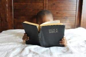 Kid reading the Bible